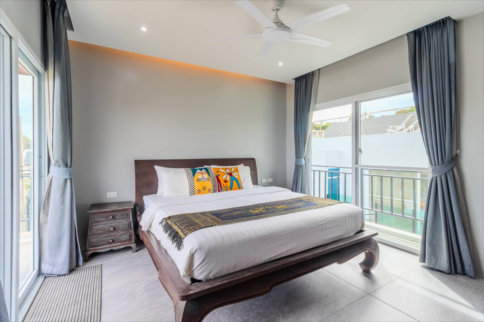 Bedroom with balcony and garden views