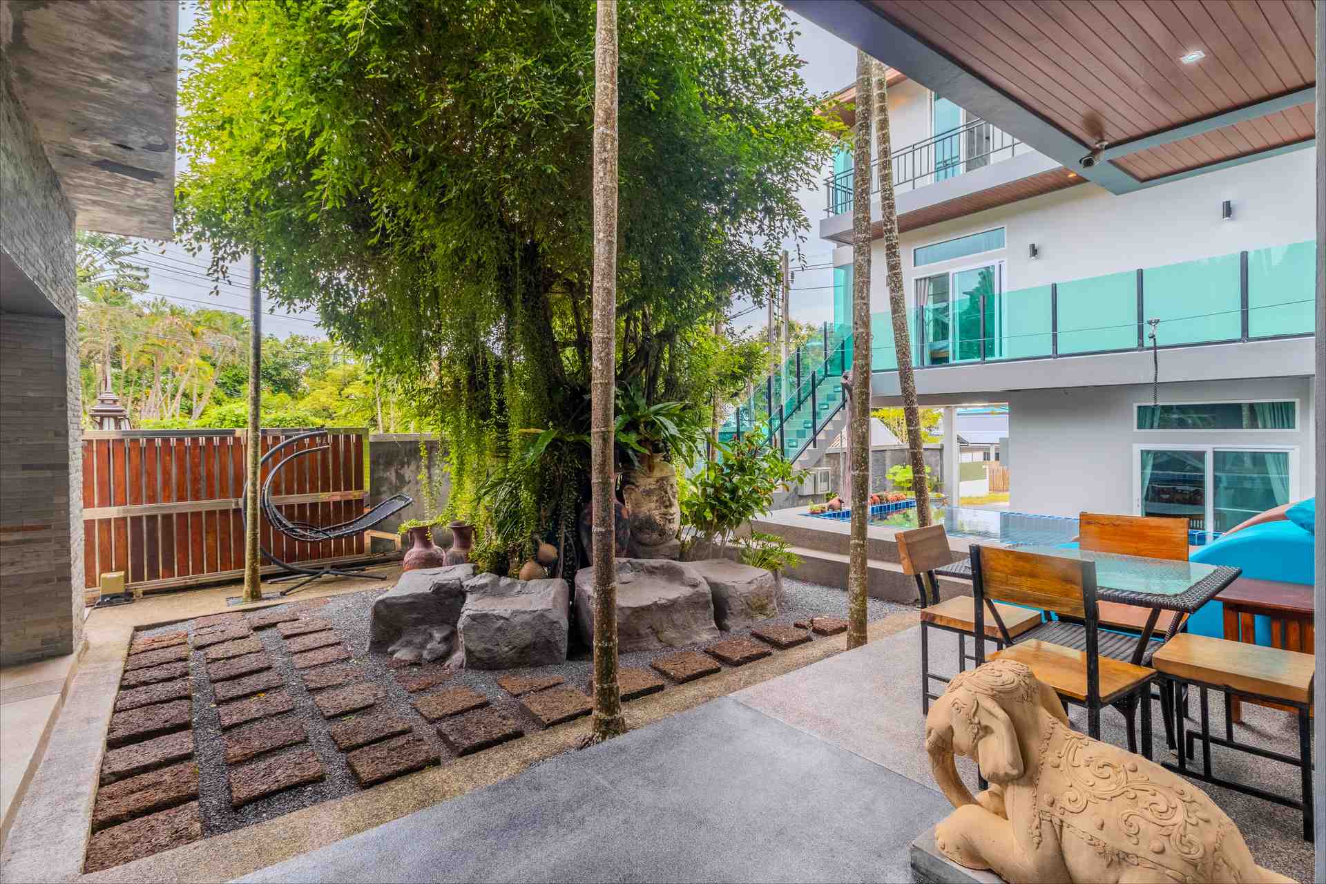 Outdoor lounge surrounded by tropical plants