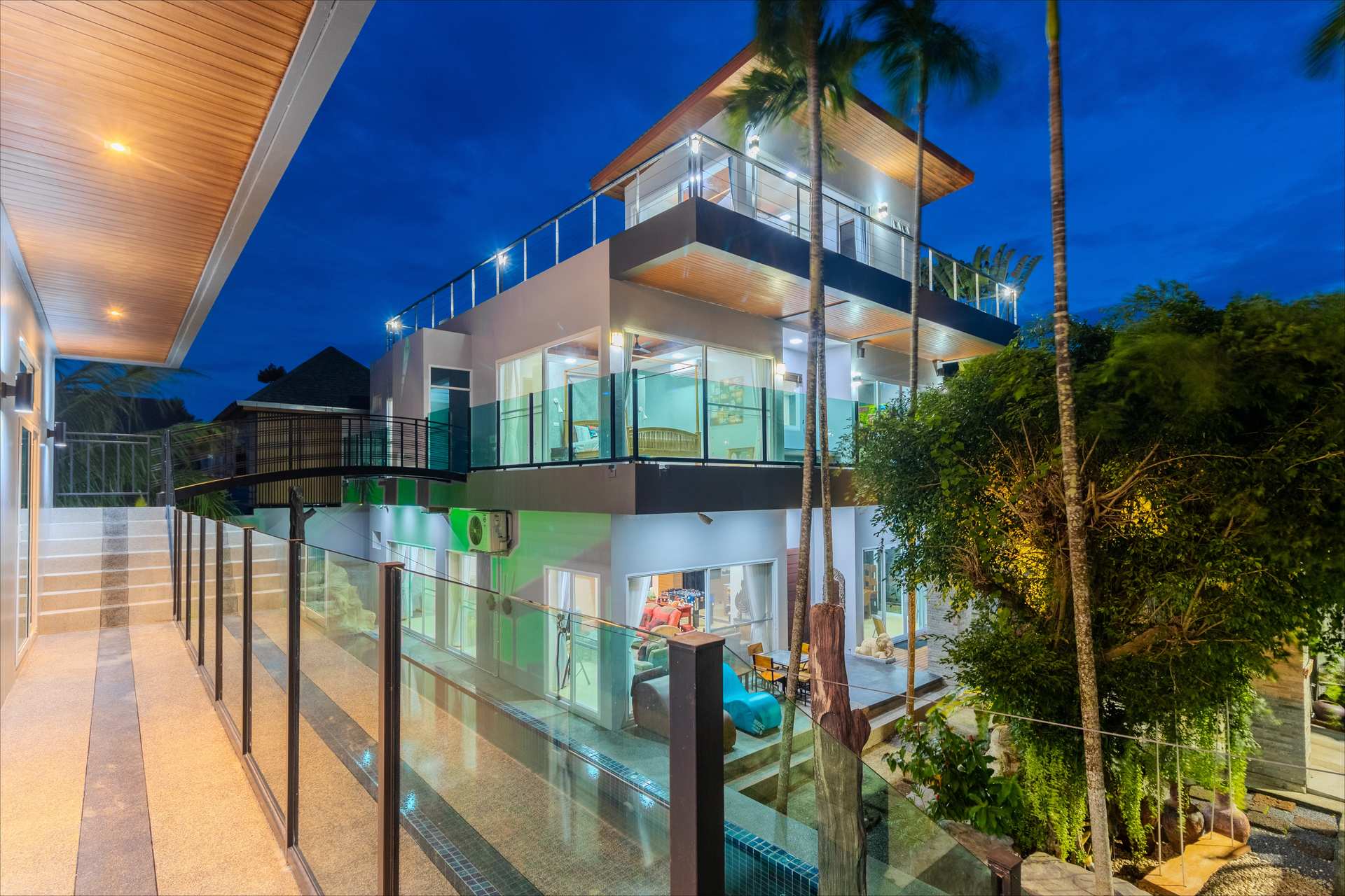 Grand exterior of the 10-bedroom luxury group villa at dusk