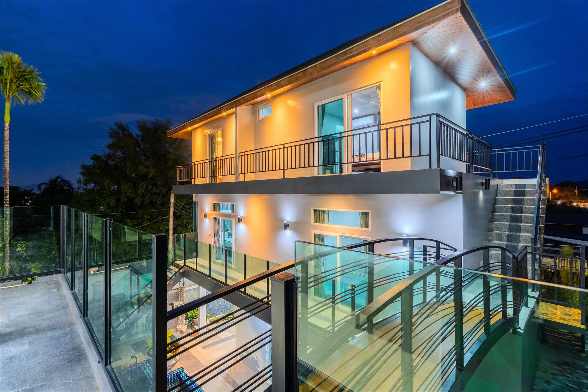 Villa entrance with tropical landscaping